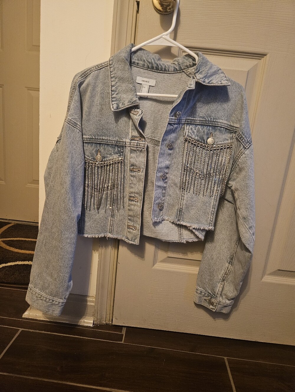 Cropped Light Wash Denim Jacket with Fringe Details